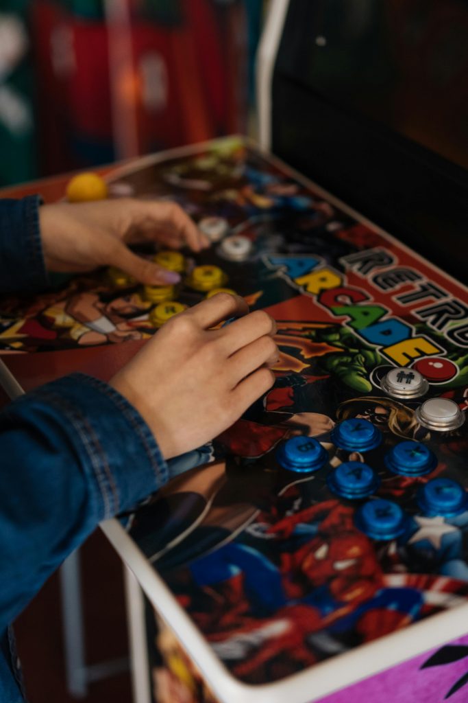 Person Playing an Arcade Game